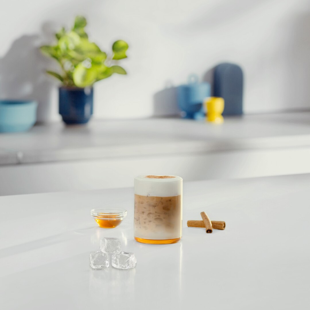 Iced Honey Cappuccino next to ingredients